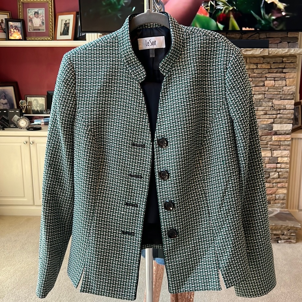 Beautiful tweed suit with solid black straight skirt. Good for work and church.